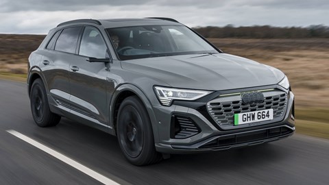 Best electric SUVs - Audi Q8 E-Tron, grey, front view, driving down the road